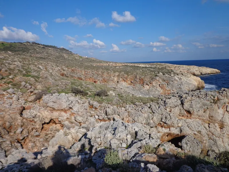 Jagged limestone rocks at the water's edge